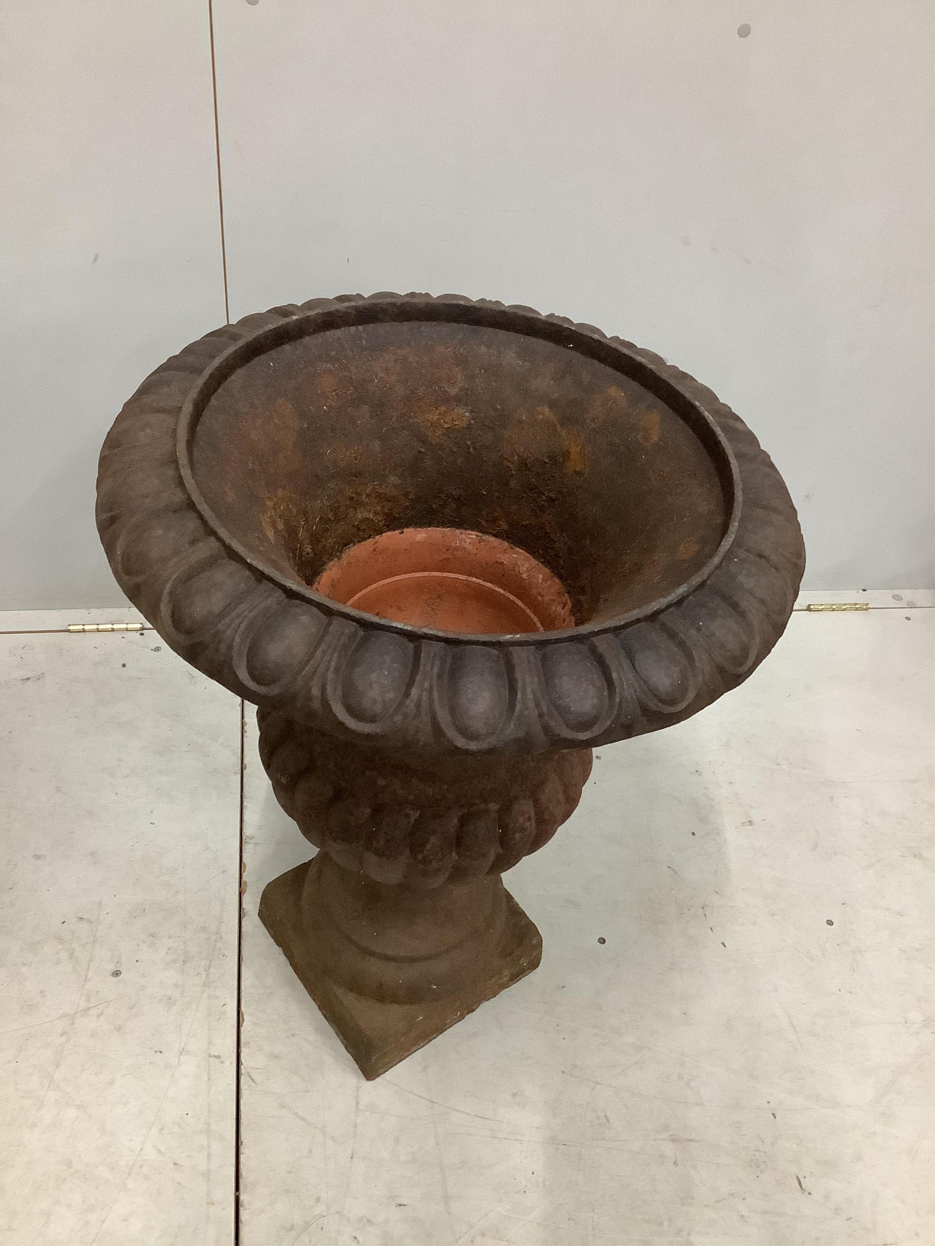 A Victorian style cast iron campana garden urn, diameter 55cm, height 74cm. Condition - fair